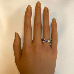 mother's ring on hand in white gold with two birthstones and diamonds