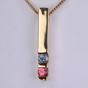 two gemstone yellow gold modern channel set pendant with bars