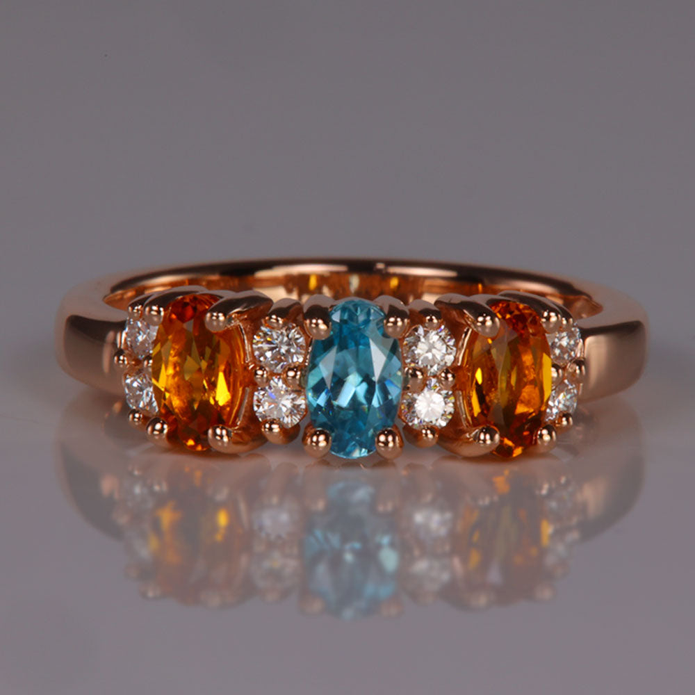 rose gold birthstone ring with three gemstones
