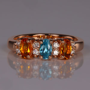 rose gold birthstone ring with three gemstones