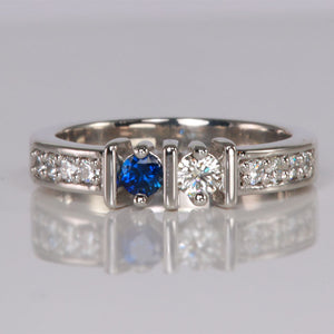 round cut birthstone ring with diamonds in white gold
