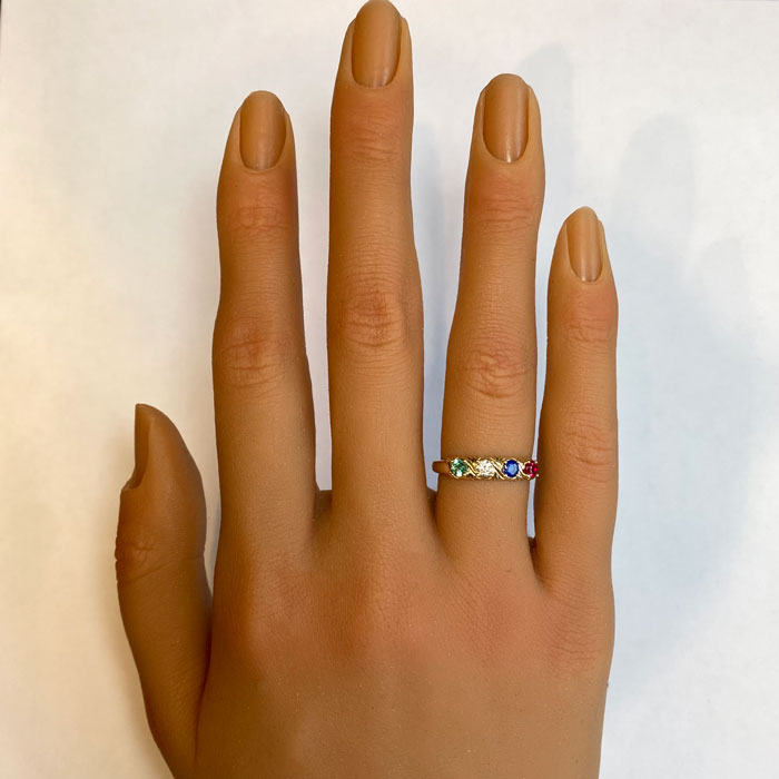 four stone gemstone mother's family ring on hand