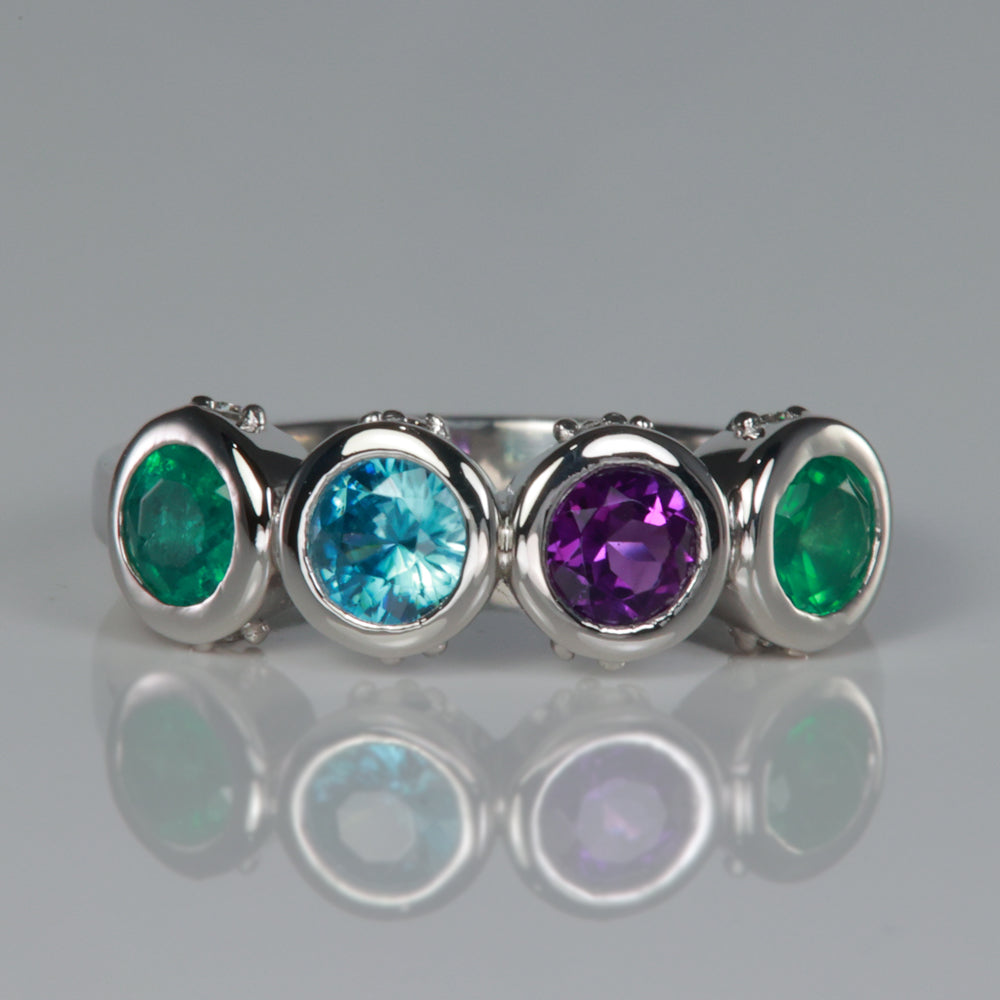 four stone bezel set mothers ring with diamonds