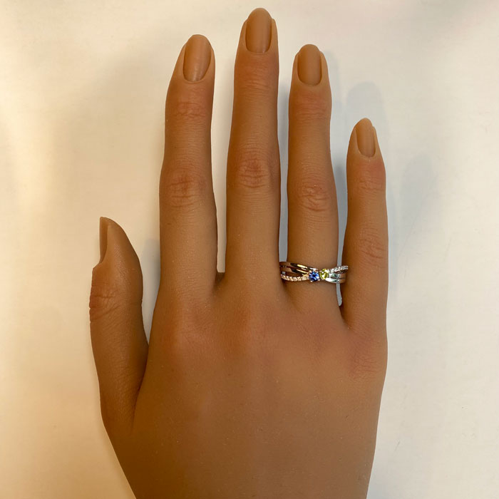 mother&#39;s ring on hand in white gold with two birthstones and diamonds