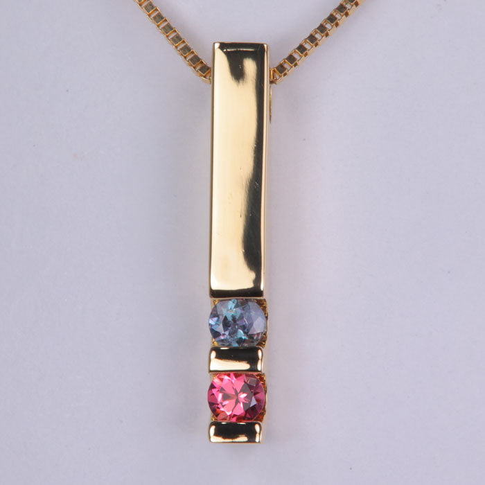 two gemstone yellow gold modern channel set pendant with bars