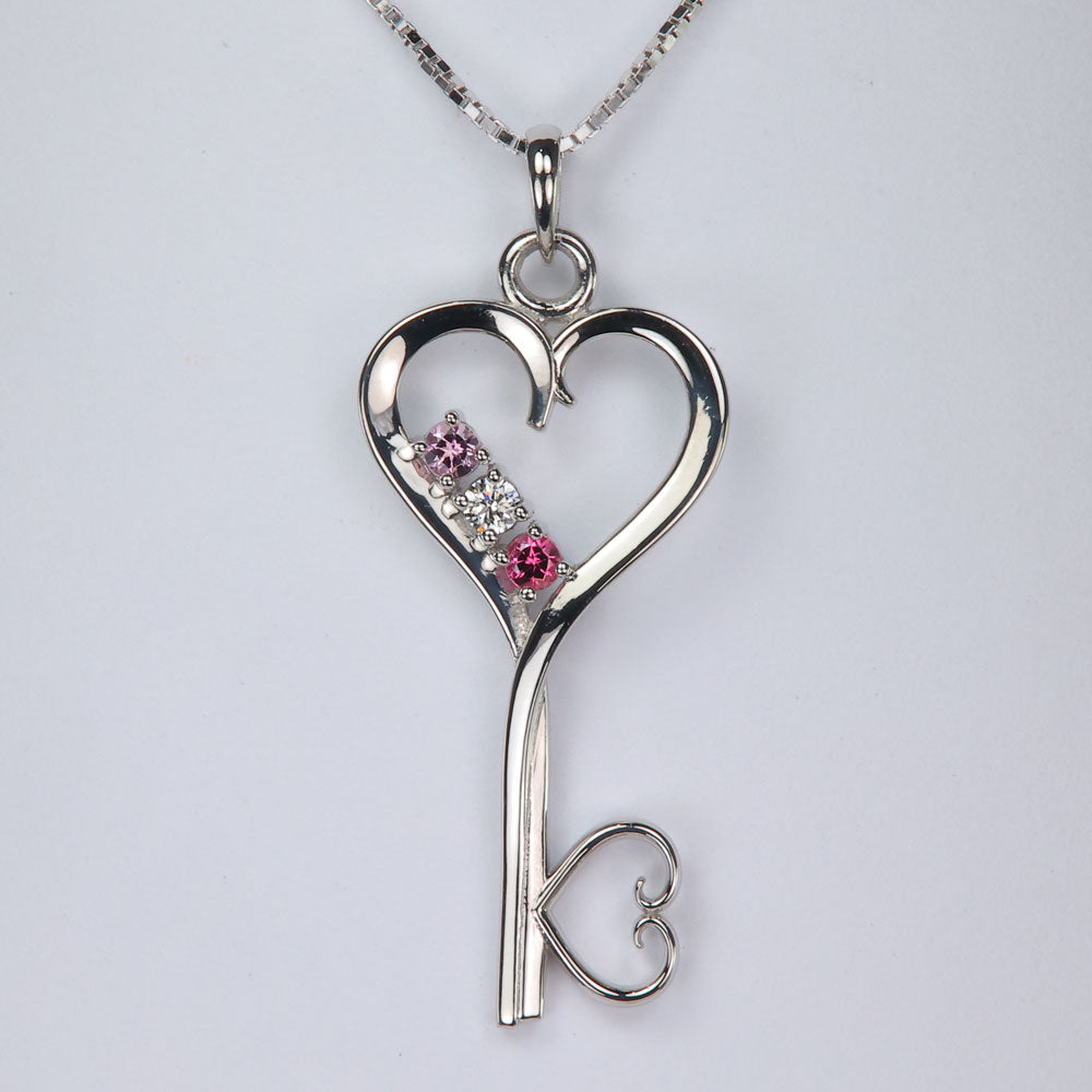 white gold mothers key pendant with gems